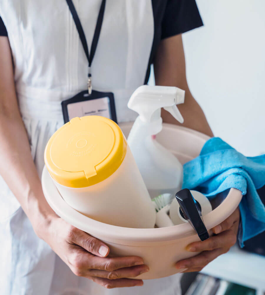 Maid 4 Dallas cleaning employee carrying supplies